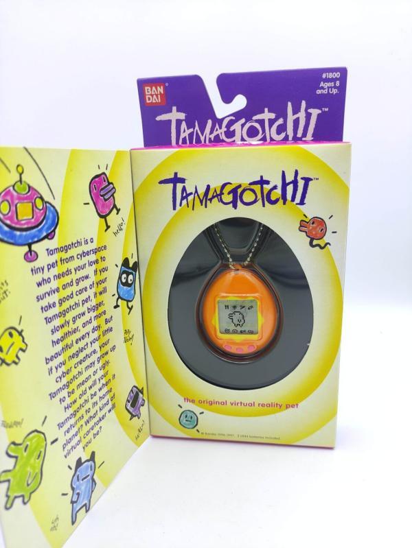 Tamagotchi Original P1/P2 orange w/ yellow Bandai 1997 English Boutique-Tamagotchis